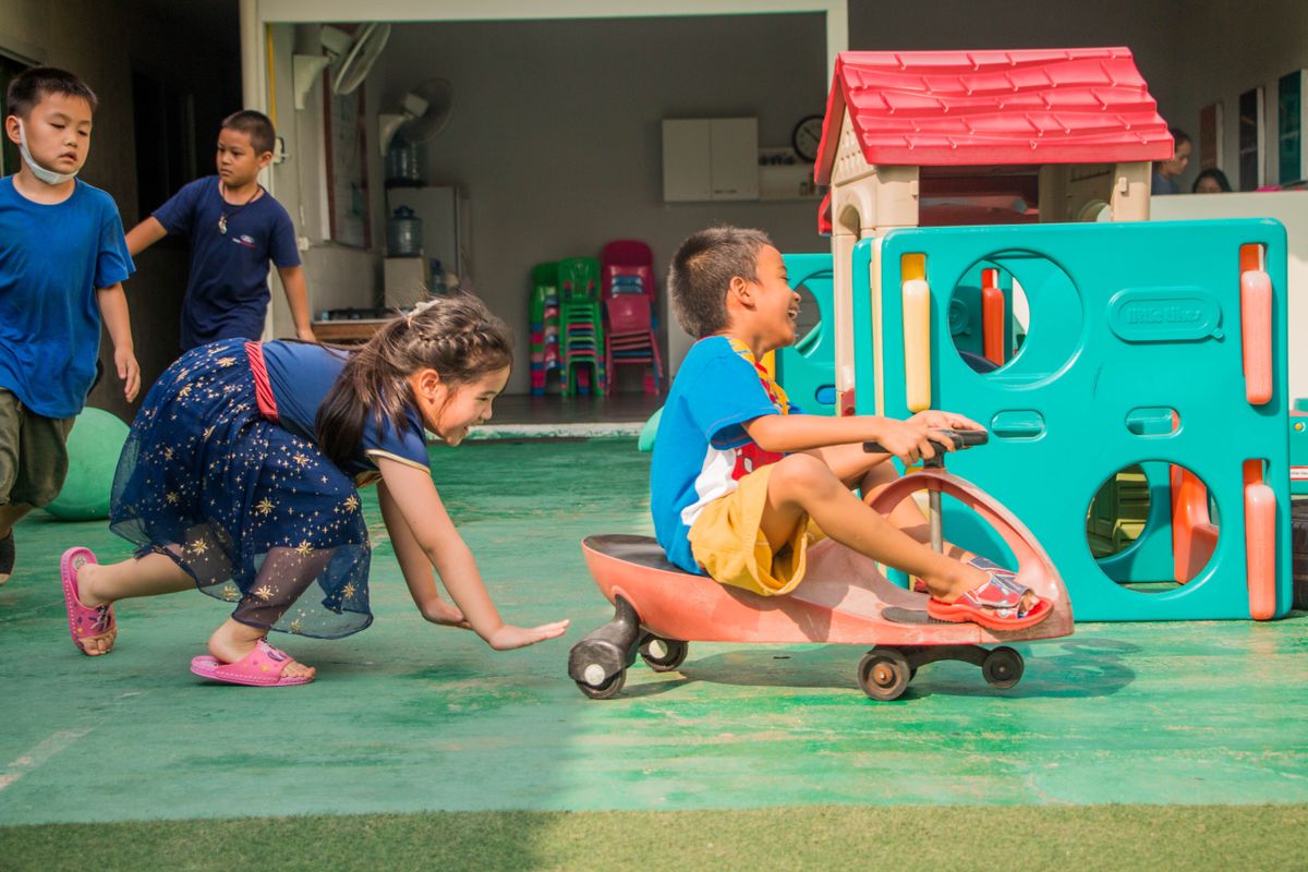 Children joyfully playing and moving around outdoors