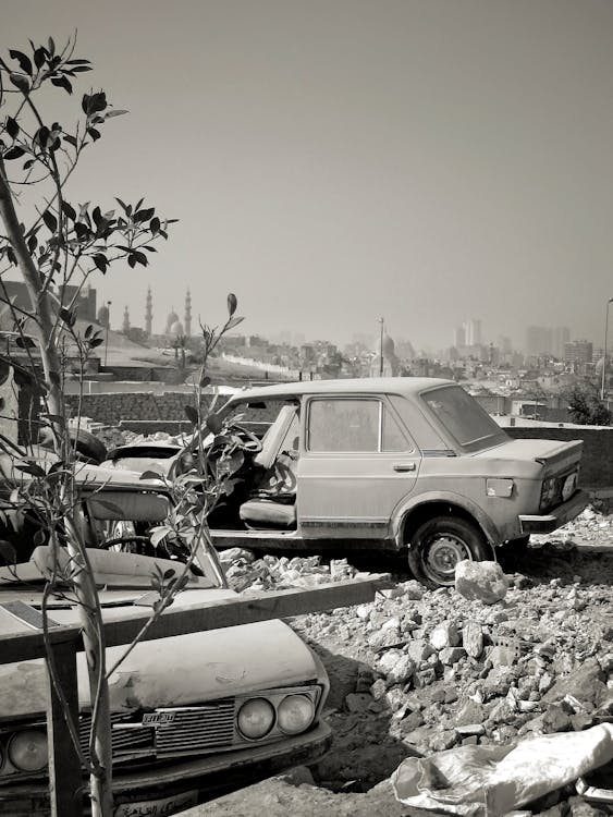 Grayscale Photo of Abandoned Cars