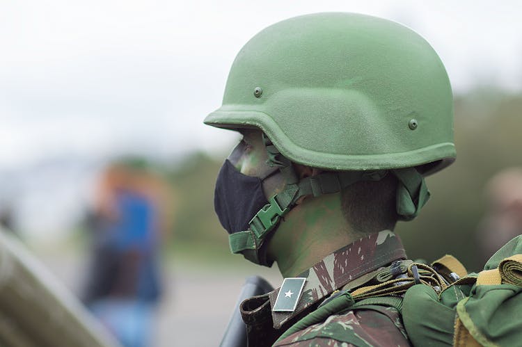 Close Up Shot Of A Man Wearing Combat Helmet