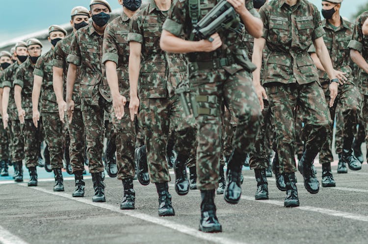 Soldiers Marching With Firearms