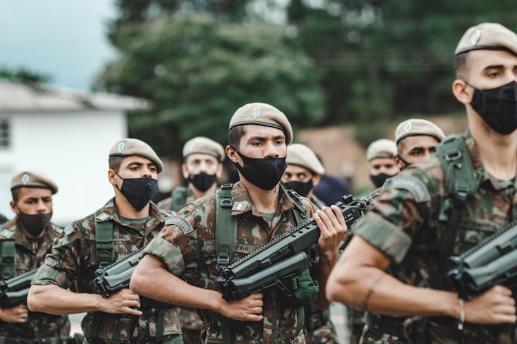 Soldiers Marching With Firearms