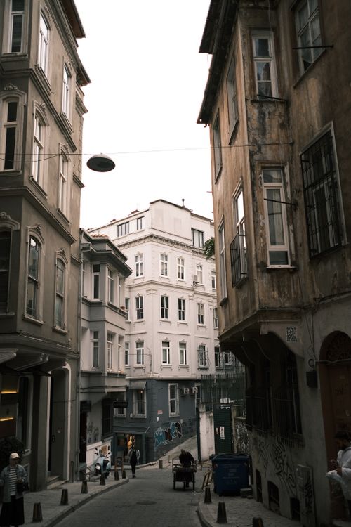 Free Explore a narrow alleyway surrounded by historic buildings, capturing old town charm. Stock Photo