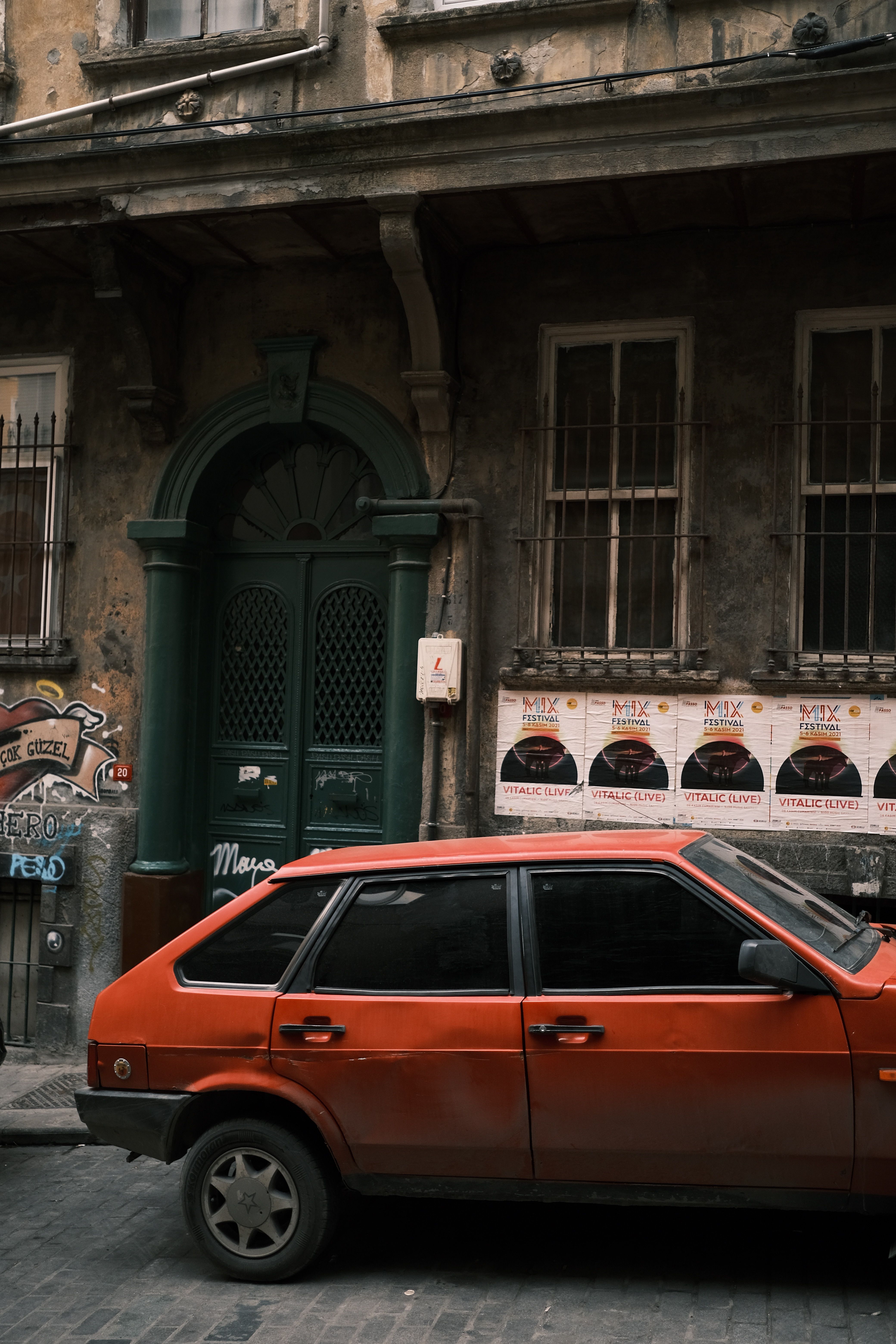 A Car Parked Outside a Building · Free Stock Photo