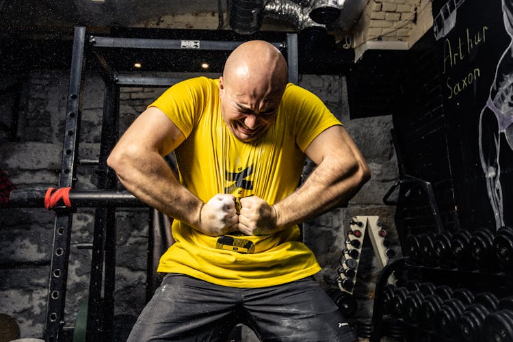 Bald Muscular Man In Gym