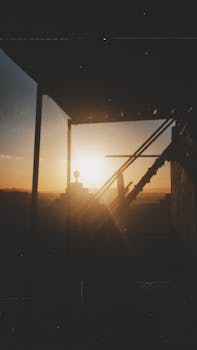 A dramatic silhouette of a staircase against a sunrise in Doğubayazıt, Turkey.