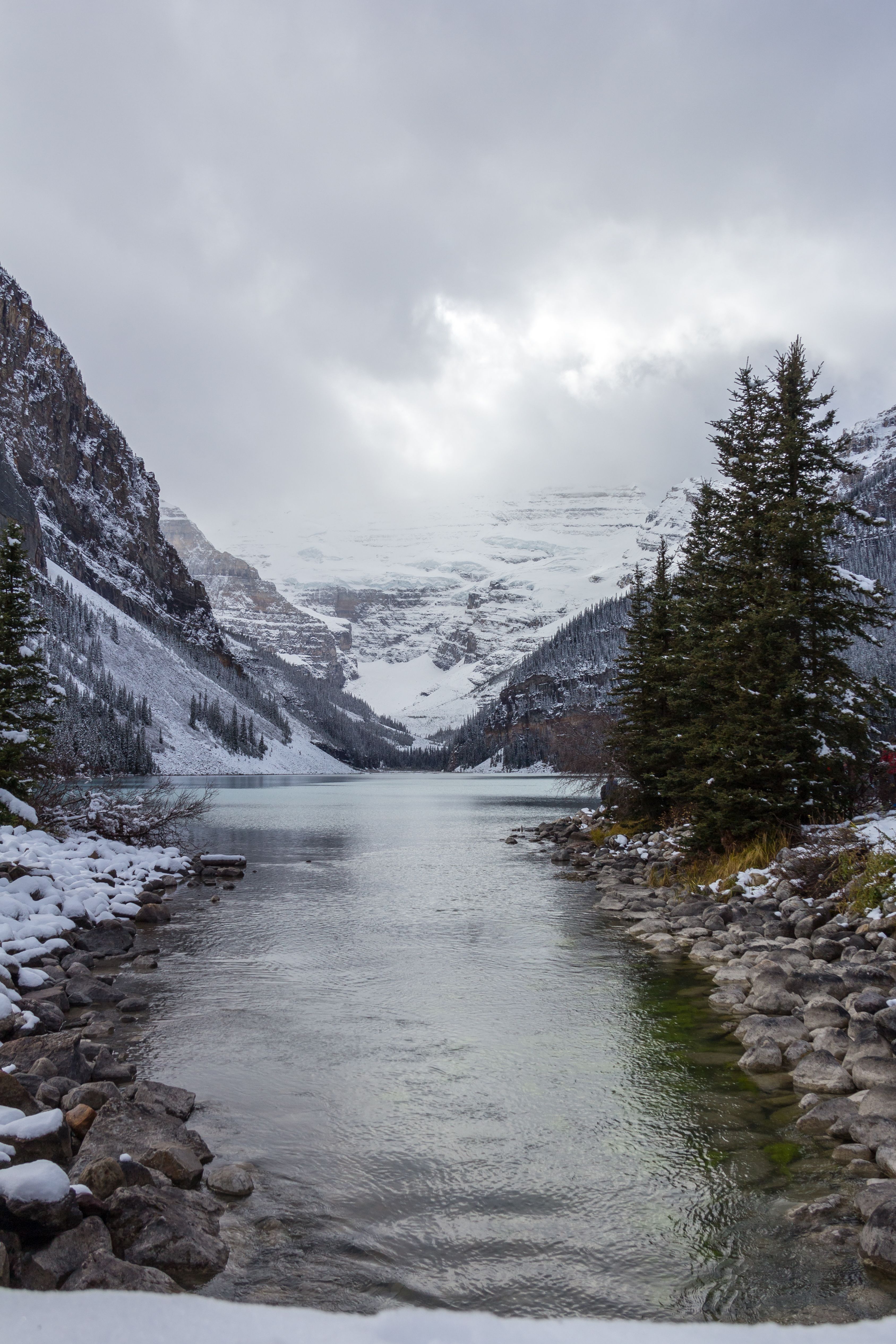 A river running through the snow covered mountains · Free Stock Photo