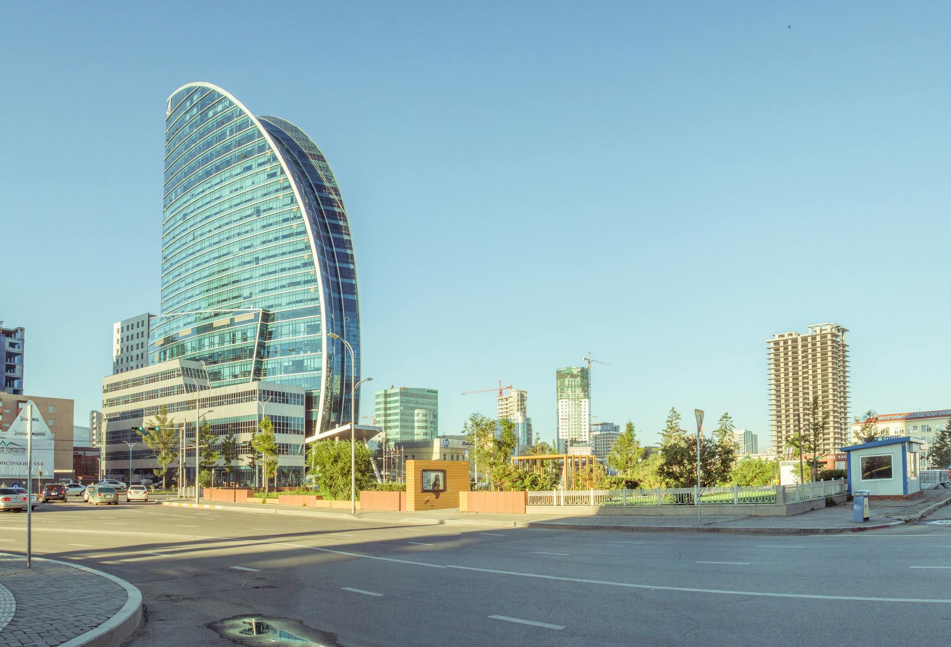 View of modern buildings in Ulaanbaatar, Mongolia with a clear blue sky.