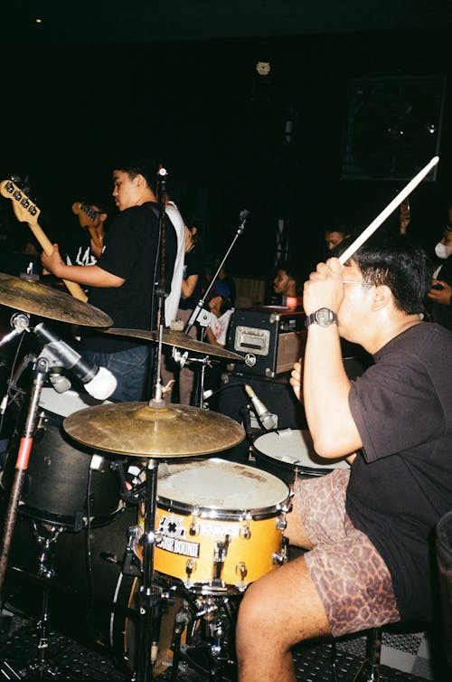 A Man Playing the Drums for a Band