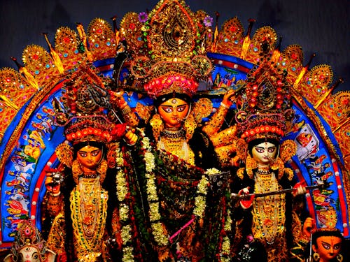 Durga Puja Statues Decorated with Leis of Flowers