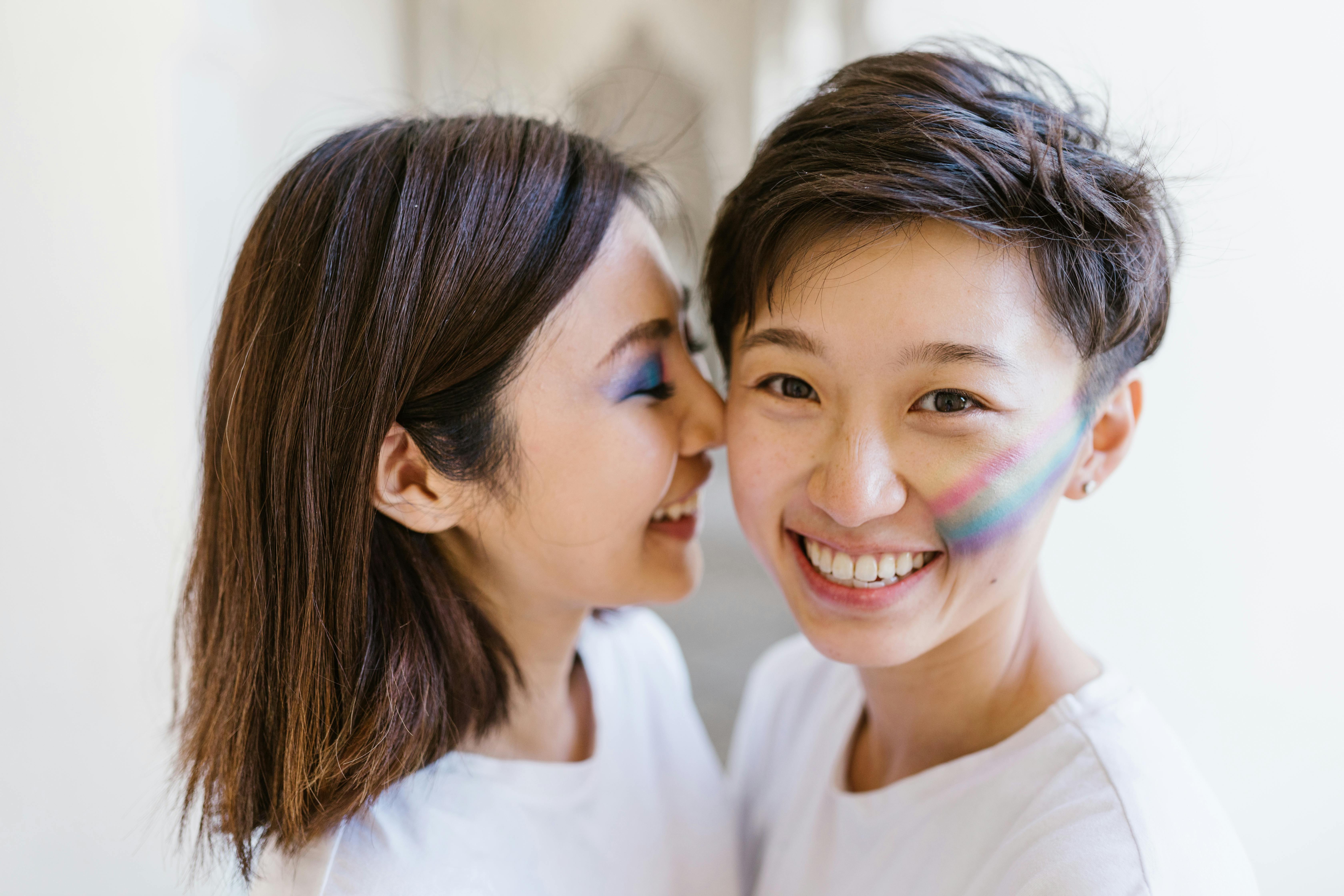 smiling women standing close to each other