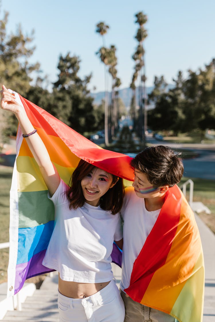 Happiness Of Lesbian Couple With LGBT Flag