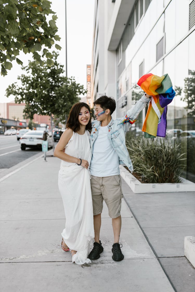 Lesbian Couple With LGBT Flag