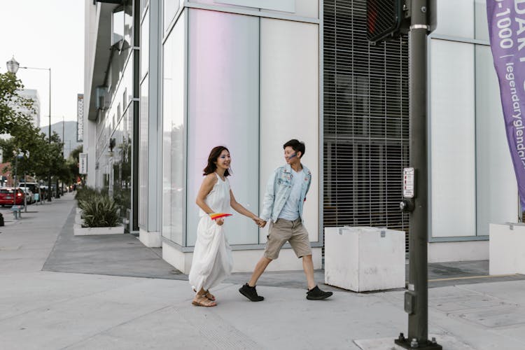 Lesbian Couple Walking On Street