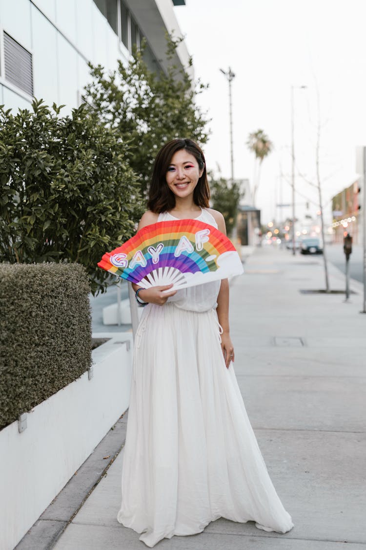 Woman Holding Rainbow Fan