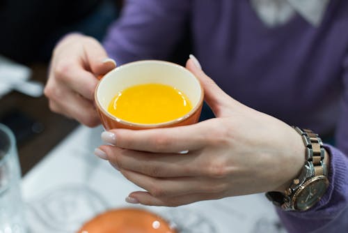 Close-Up Shot of a Person Holding a Cup of Tea