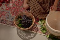 Woman Sitting, Basket full of Grapes and Wooden Vat