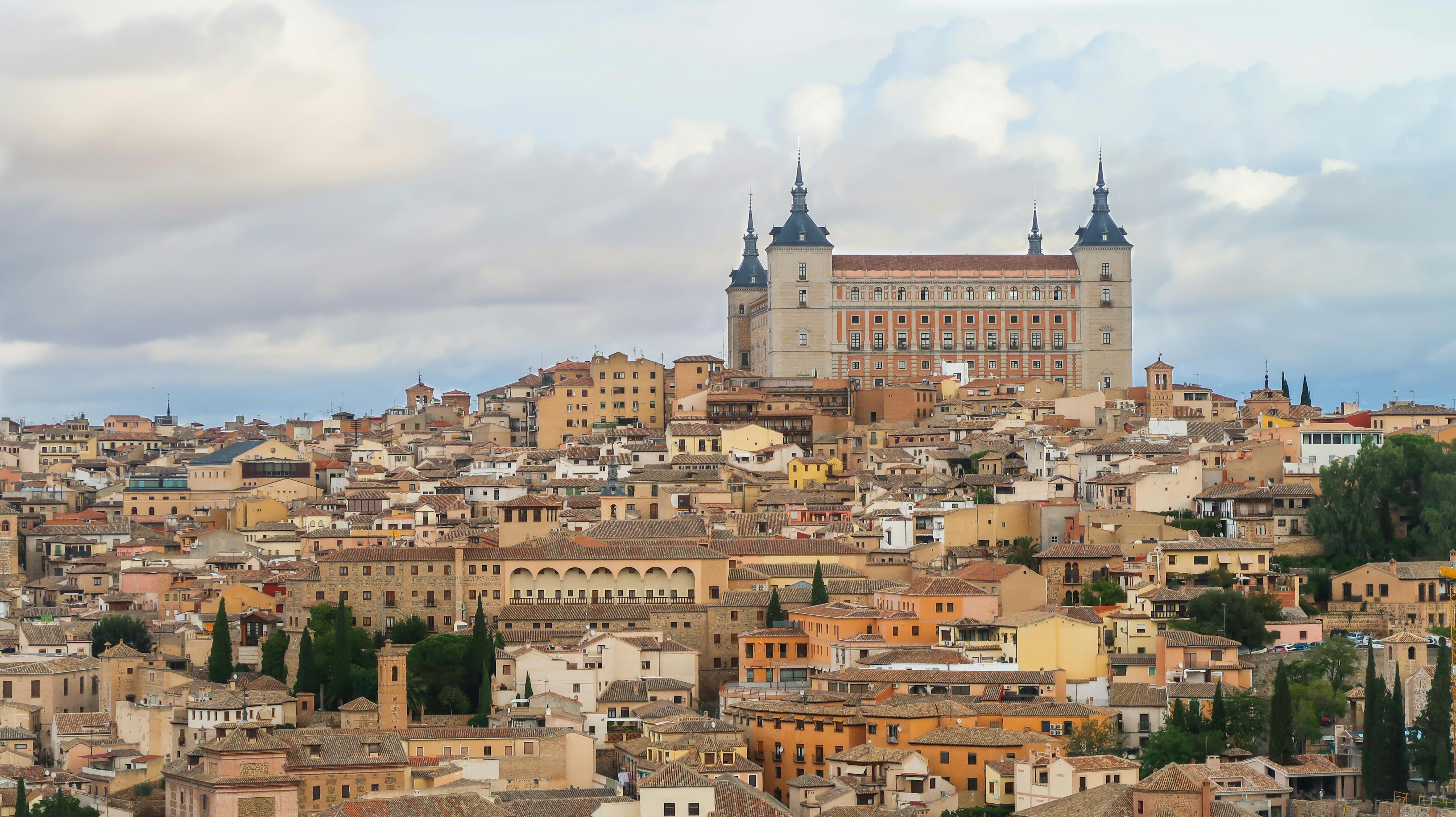 Free Stunning aerial view of Toledo, Spain with the iconic Alcazar dominating the historic cityscape. Stock Photo
