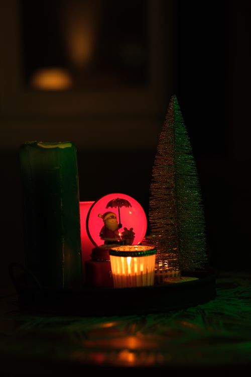 Free Festive Christmas candles and lights create a warm holiday ambiance. Stock Photo