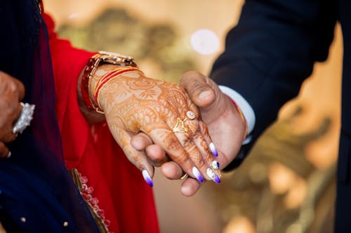 Free A Couple Holding Hands Stock Photo