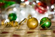 Gold and Green Baubles on White Textile