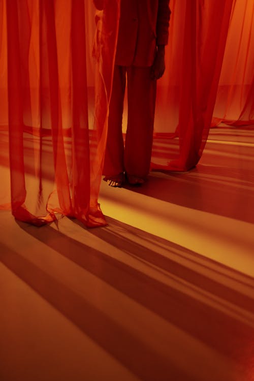 Free Man among Red Curtains Stock Photo