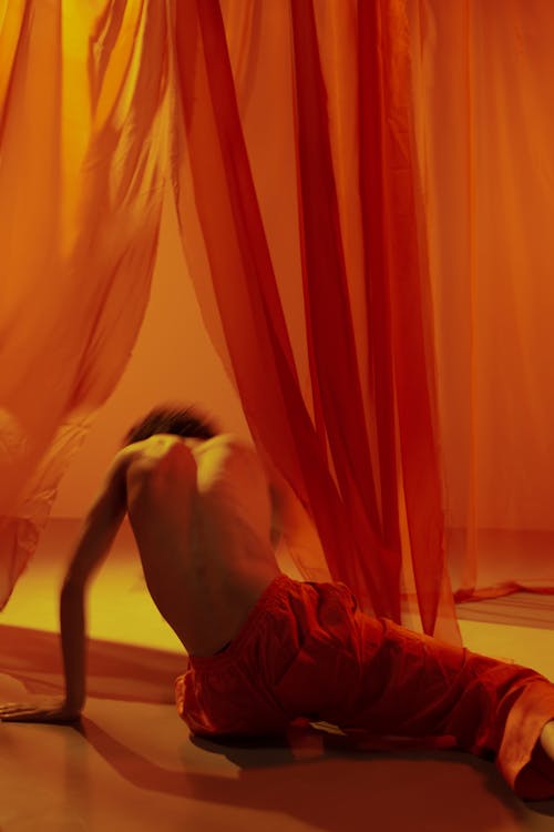 Man Dancing Between Fabric 