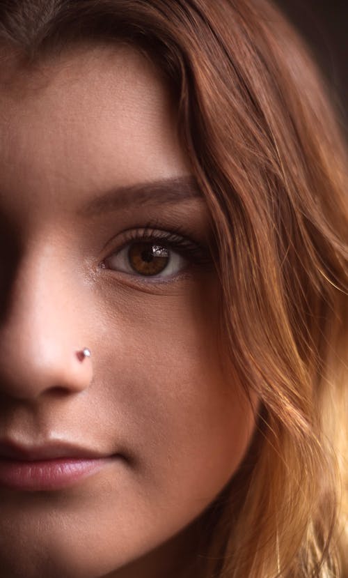 Close-up Photo of a Woman with Nose Piercing