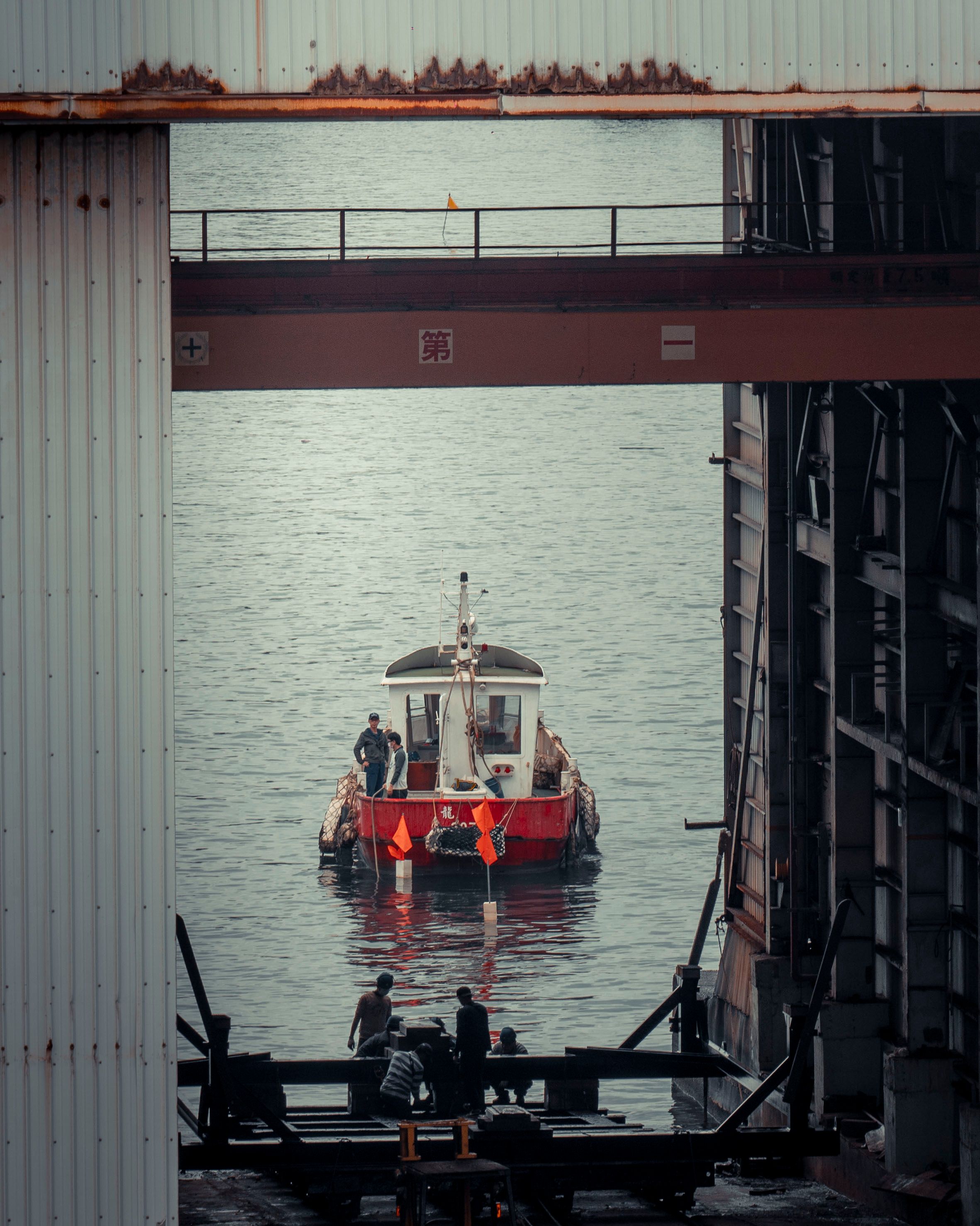 Man Walking on a Platform in a Port · Free Stock Photo