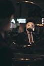 Man in a Mask Looking at his Reflection in the Mirror