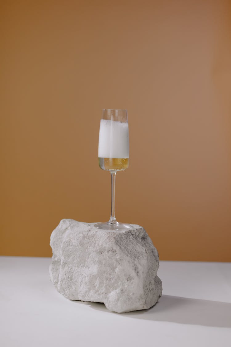 Wineglass On Stone On White Table