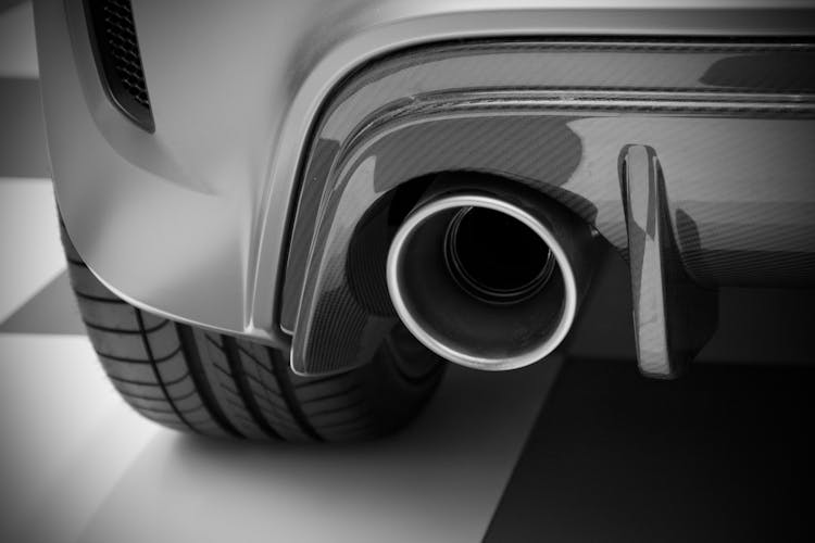 Black And White Abstract Photo Of A Vehicle With Exhaust Pipe