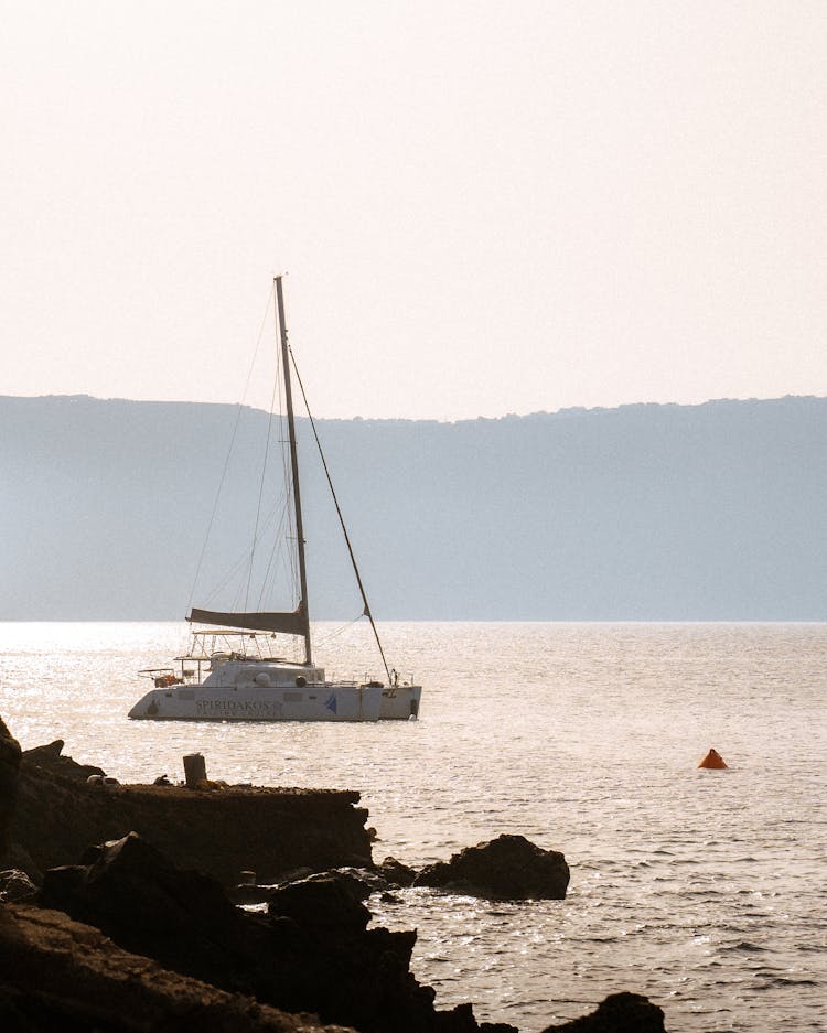 Boat Sailing On A Shining Water