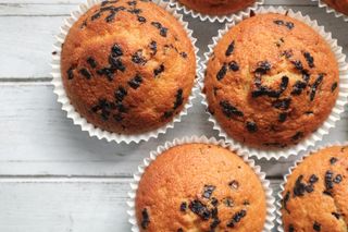 Chocolate chip muffins on a white surface — photo by Sara on Pexels