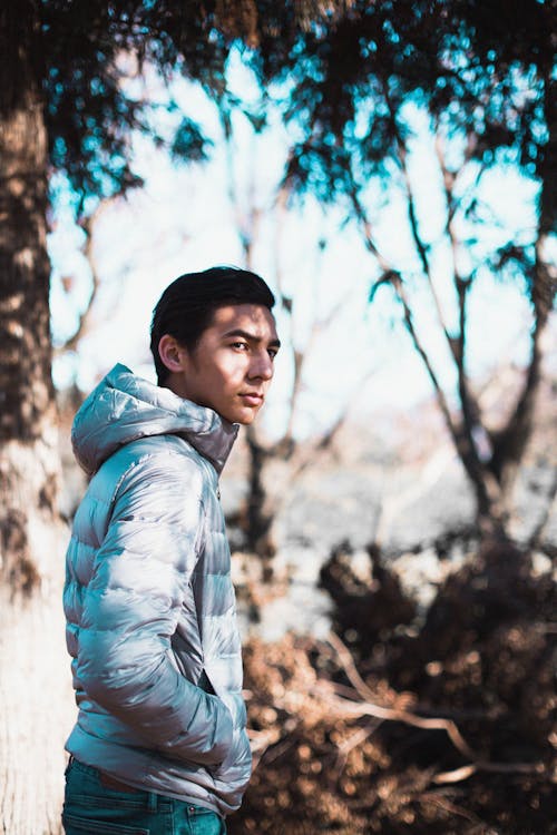 A Man in Puffer Jacket with His Hand on His Pocket