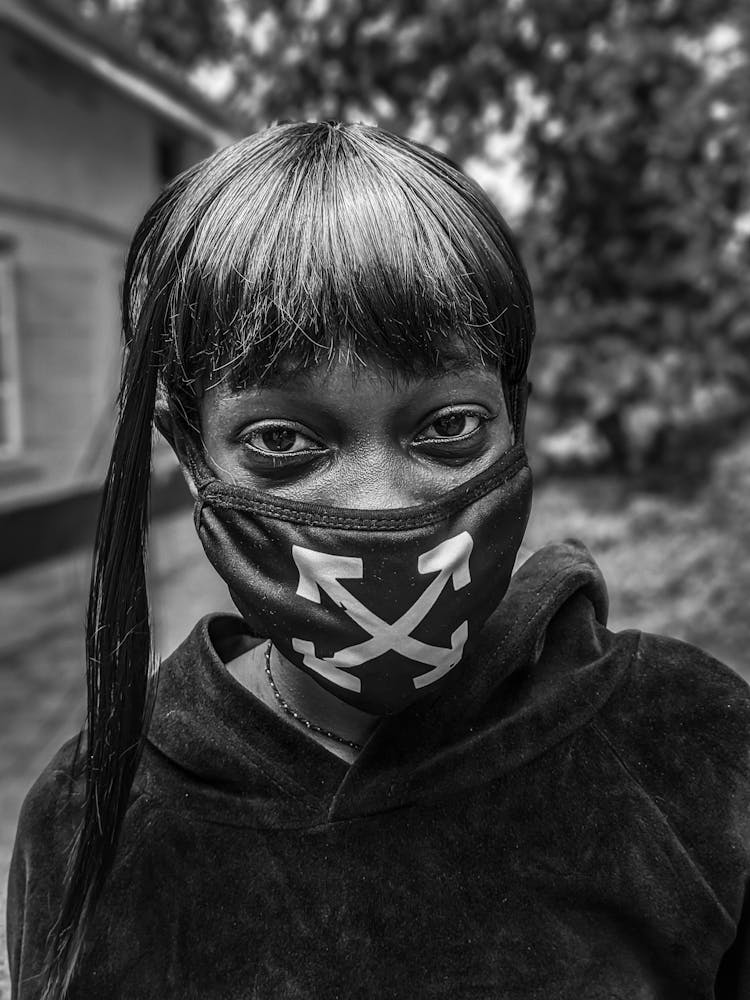 Black And White Portrait Of A Girl In A Mask