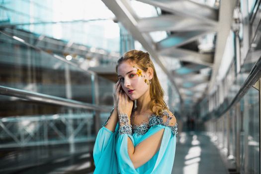 A Woman in a Blue Dress and Flower Accessories