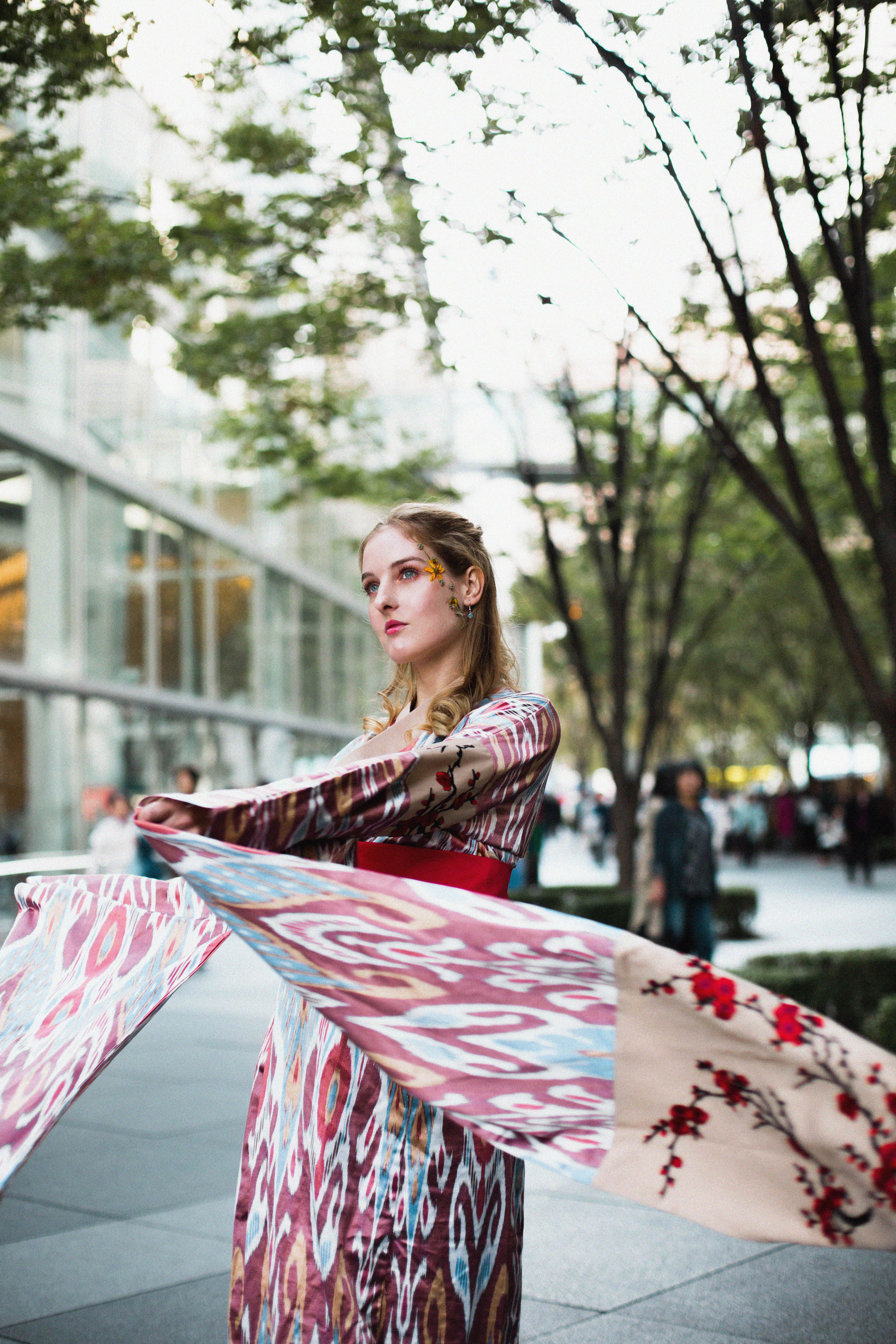 Stylish woman in kimono in Tokyo, blending traditional and modern fashion.