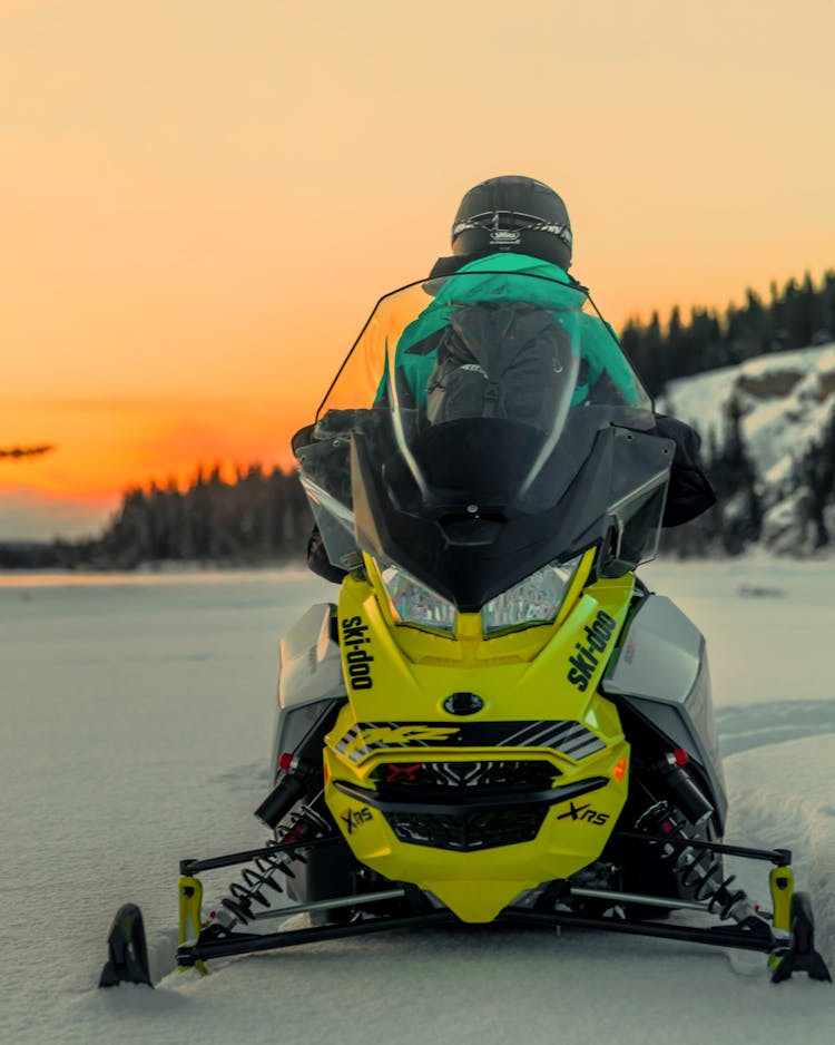 Driver Sitting On A Snowmobile