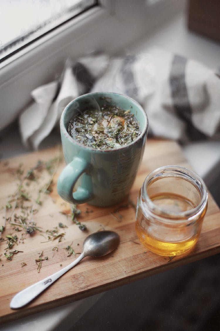 Honey And Tea On Cutting Board