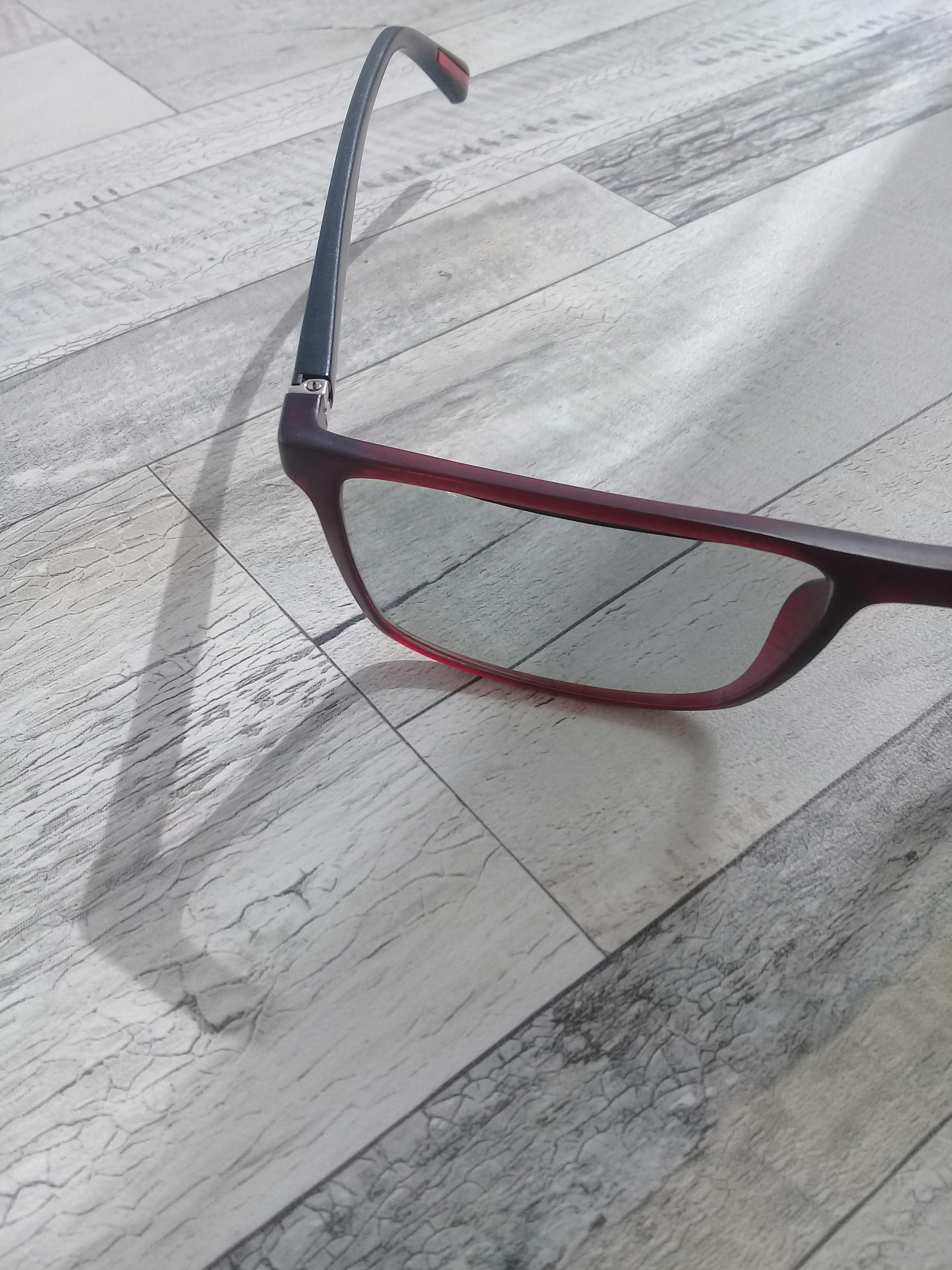 Engineer working on a circuit board with a soldering iron under magnification