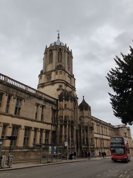 Stunning view of Tom Tower, iconic landmark in Oxford, England under cloudy skies.