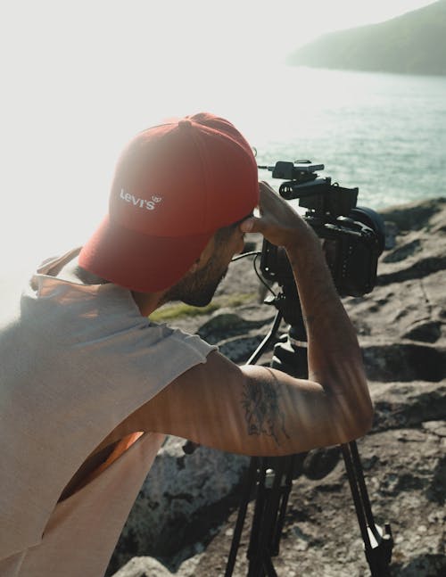 Photographer with Camera on Tripod