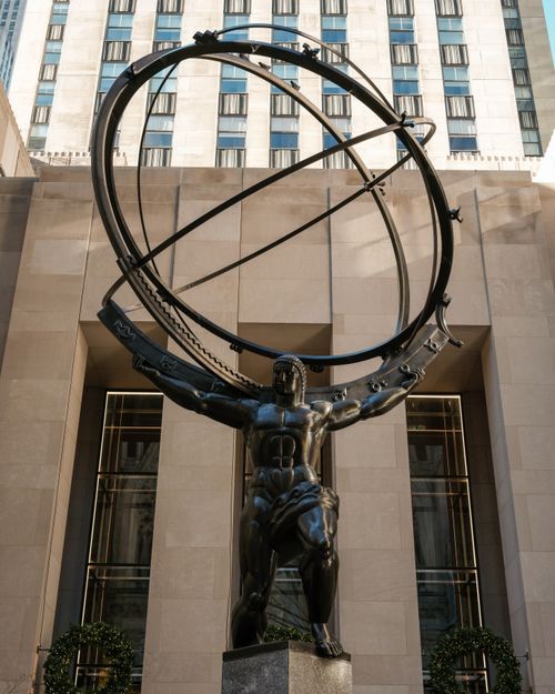 Free Atlas statue at Rockefeller Center, New York, showcasing the art deco style in daylight. Stock Photo