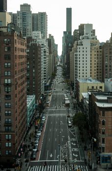 Explore the urban landscape of Manhattan with skyscrapers and bustling streets from above.