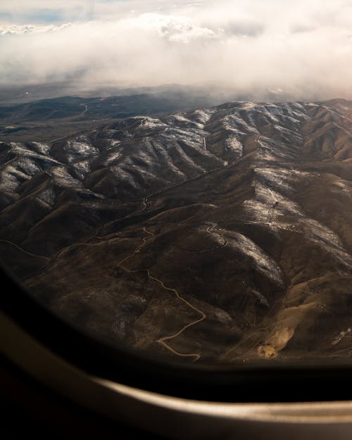 Aerial Photography of Mountains under the Cloudy Sky