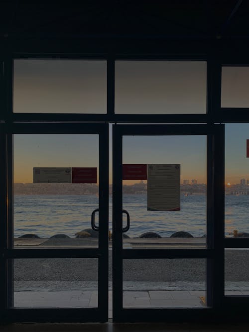 A View of a Lake from the Glass Doors