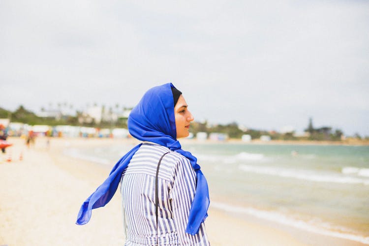 Woman In A Headscarf On The Beach