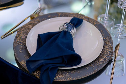 Blue Textile with Glass Ring on White Ceramic Plate