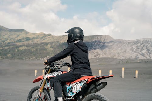 A Person in Black Jacket Riding on Motorcycle