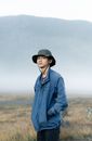 Woman in Blue Denim Jacket Wearing Black Hat
